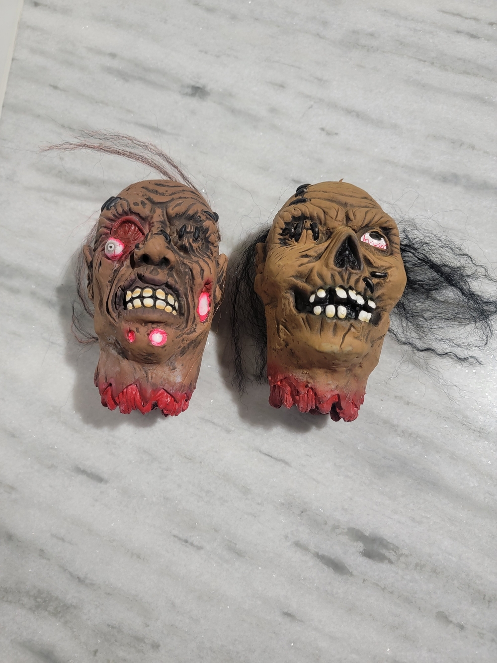 Pair of Halloween Severed Zombie Head Props - Brown with Red Accents